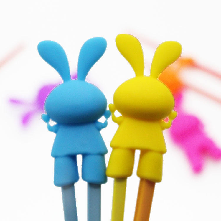 Cabeza de palillo auxiliar de silicona con forma de conejo de dibujos animados para entrenamiento de niños