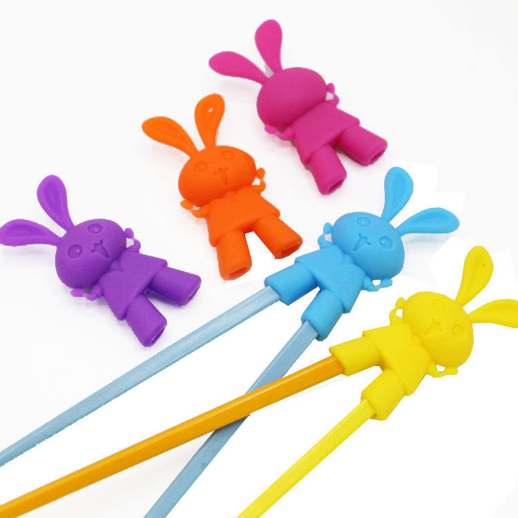 Cabeza de palillo auxiliar de silicona con forma de conejo de dibujos animados para entrenamiento de niños