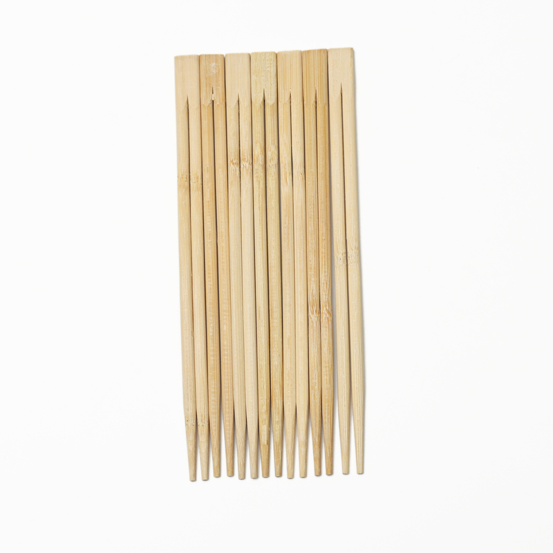 Palillos de bambú desechables chinos en palillos de madera de bambú de papel individual