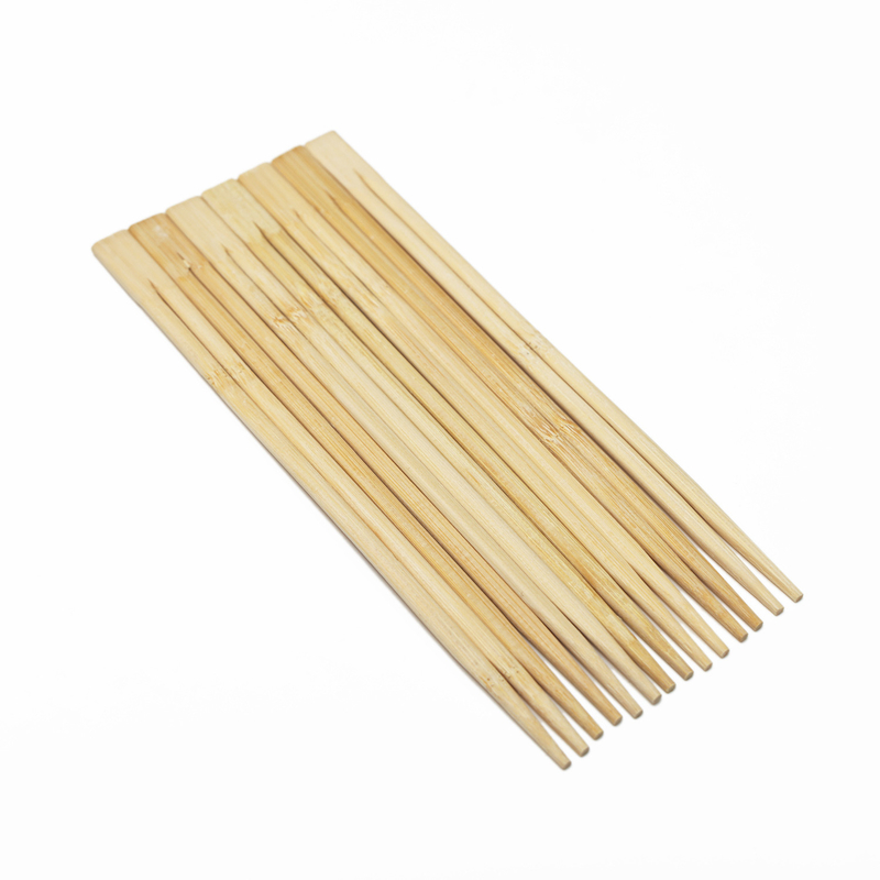 Palillos de bambú desechables chinos en palillos de madera de bambú de papel individual